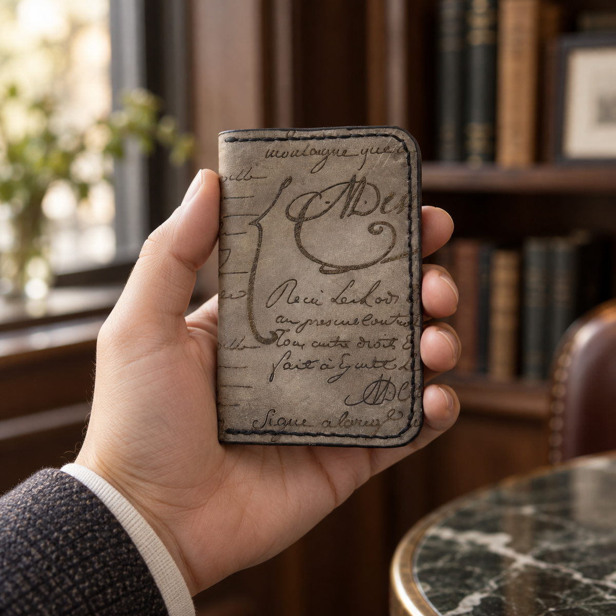 Dove-Grey Script Folded Card Holder, lifestyle shot, held in hand