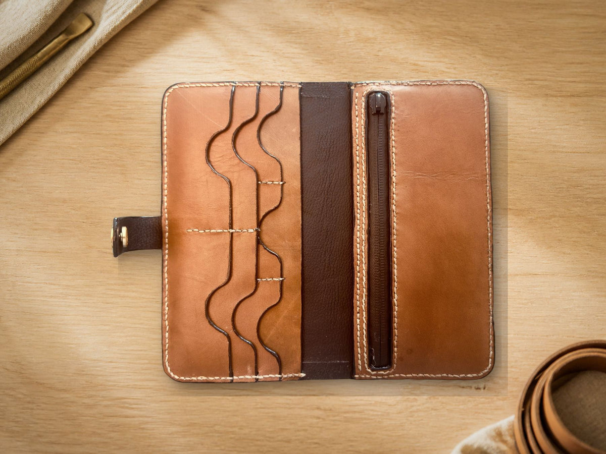 Long Wallet, cognac leather, closed straight-on view showing embossed wave line