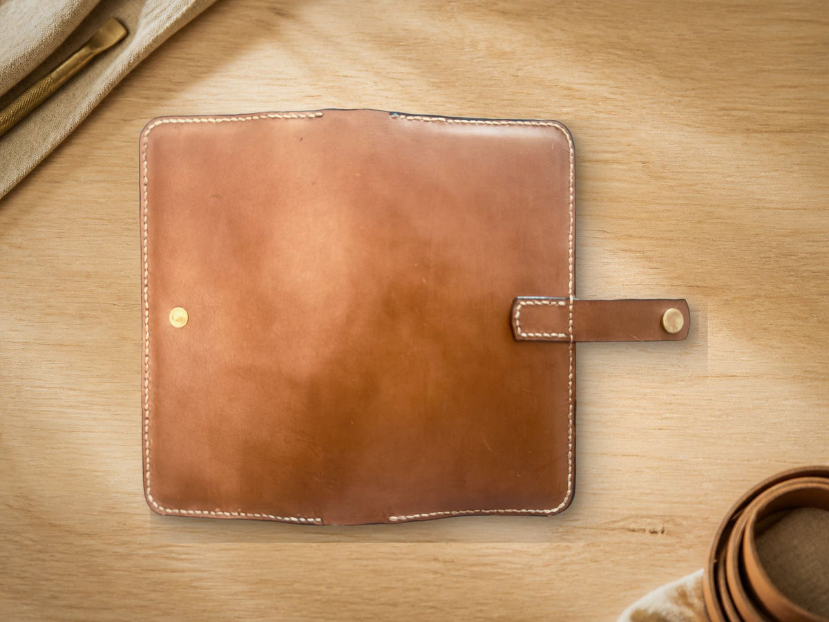 Long Wallet, cognac leather, exterior spine view lying flat