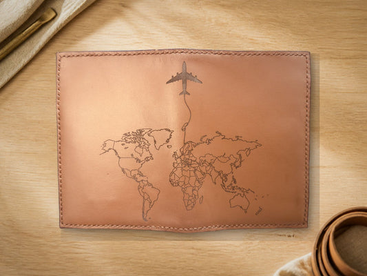 World Map Passport Holder, closed, front showing engraved world map